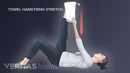 Woman performing the supine hamstring towel stretch for sciatica pain relief