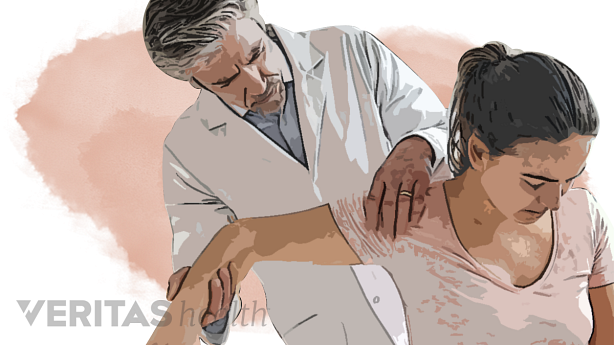 An image showing a doctor evaluating a patient.